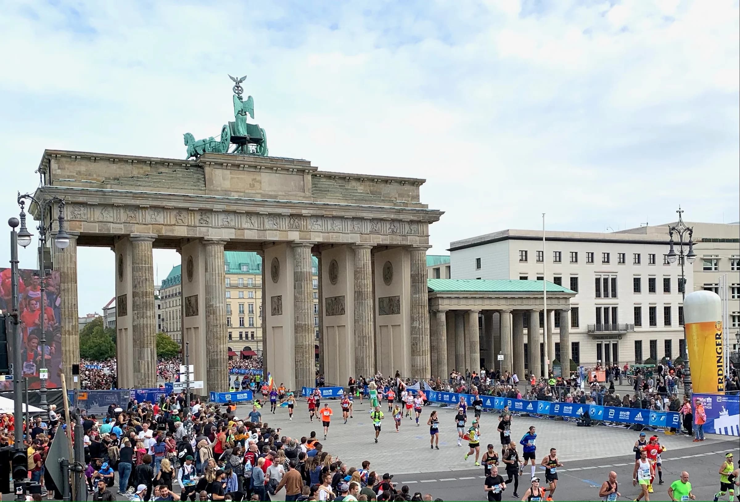 Berlin Marathon runners emerging from the Brandenburg Gate towards the finish, 25 September 2022