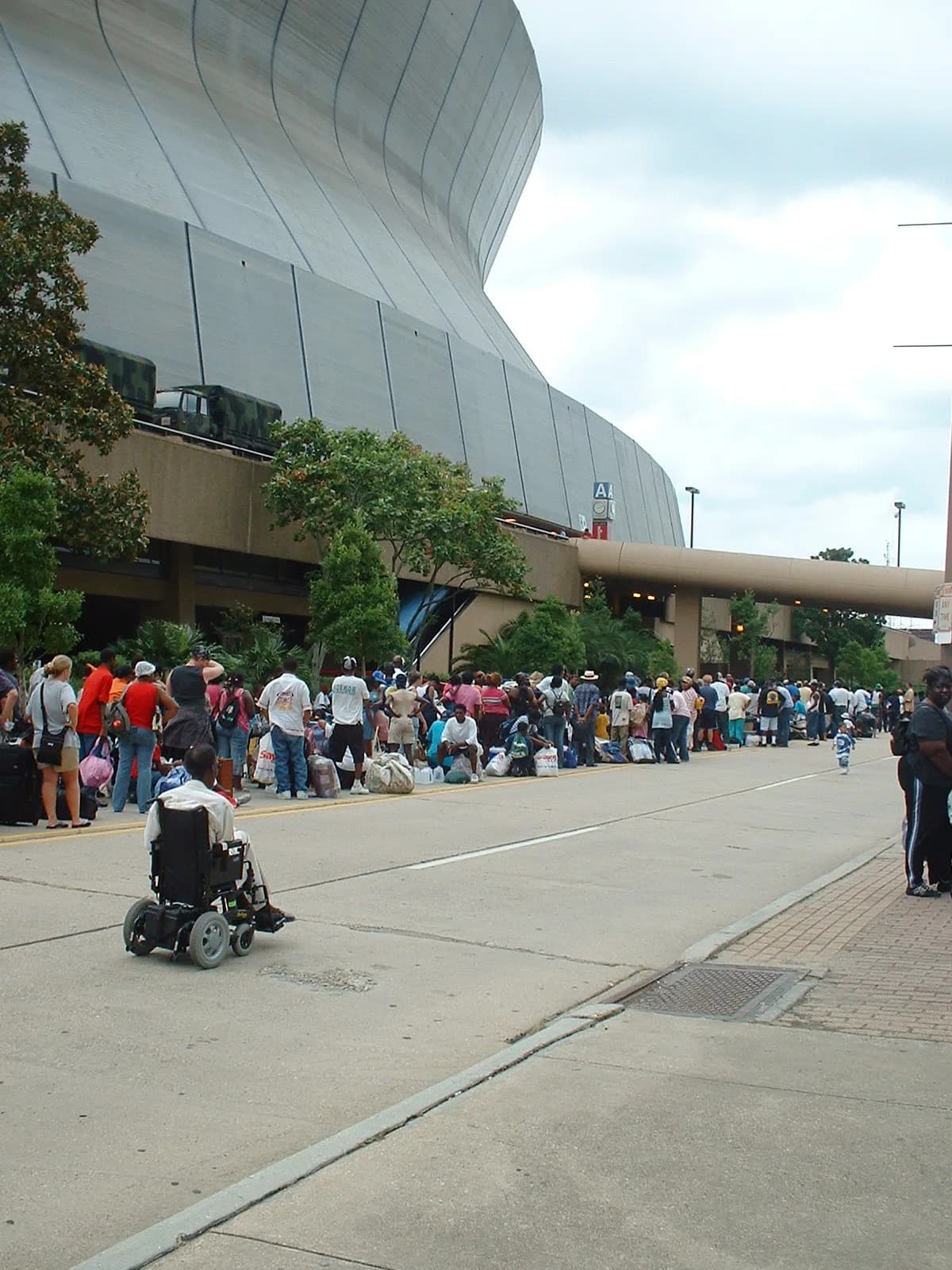 Residents line up outside the Superdome as it opens as a hurricane shelter before Katrina in August 2005.