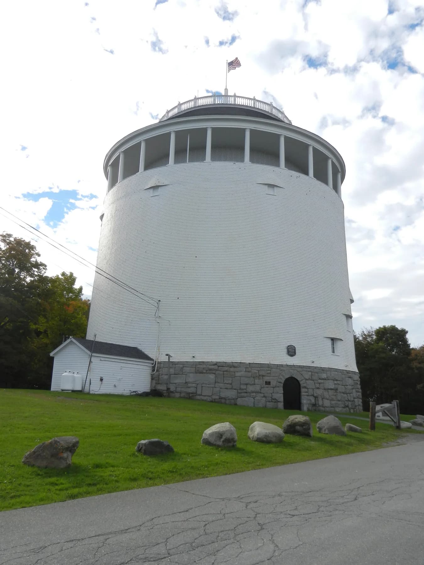 The white timber exterior and observation deck of Thomas Hill Standpipe in Bangor.